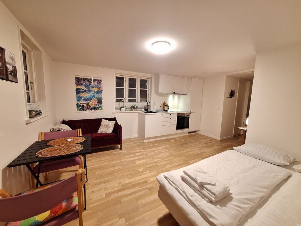 studio apartment Tórshavn Faroe Islands couple travel bedroom bed couch table kitchen