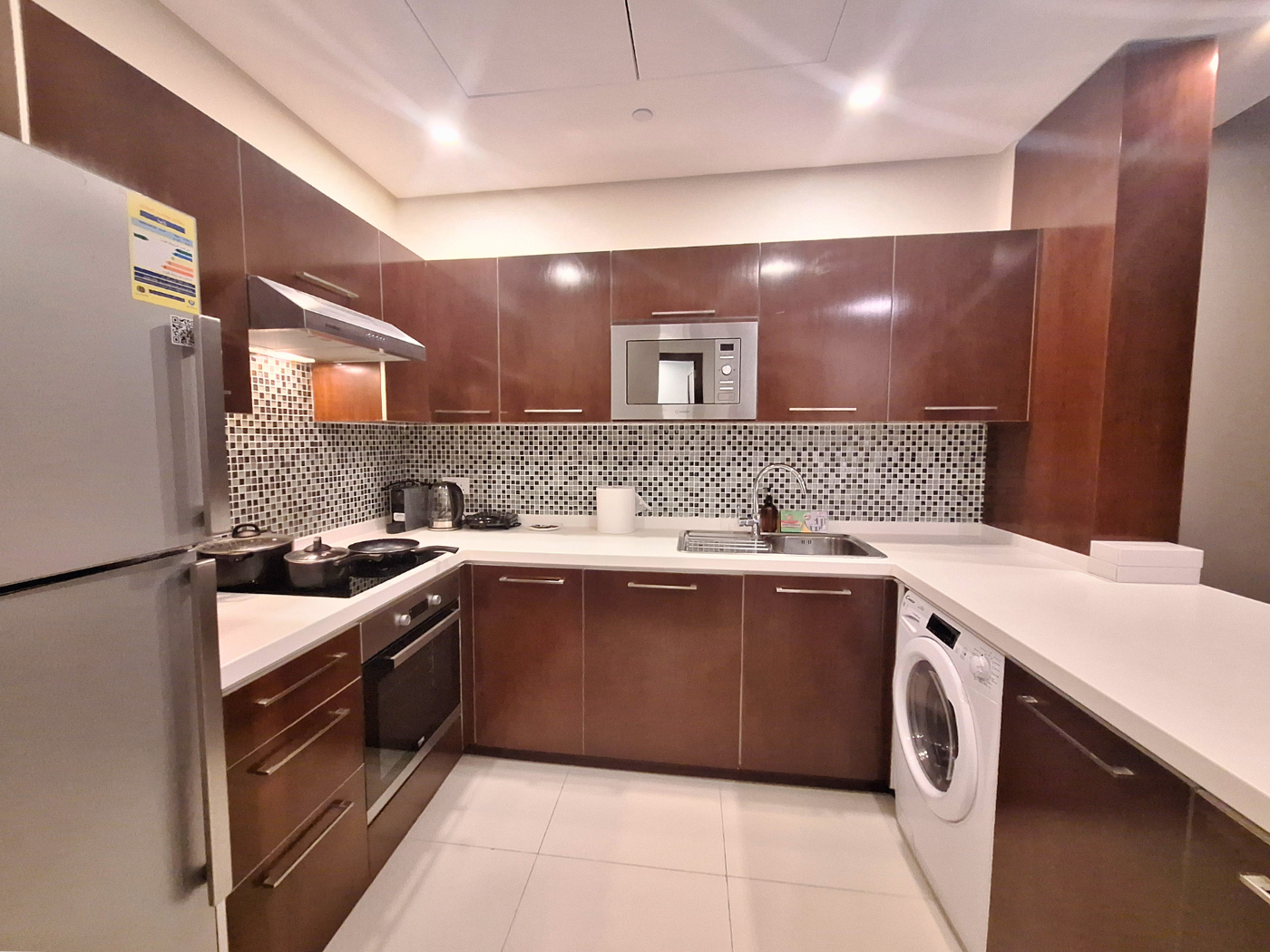 kitchen accommodation in Bahrain pots pans cutlery dishware washing machine dryer Airbnb microwave kettle couple travel