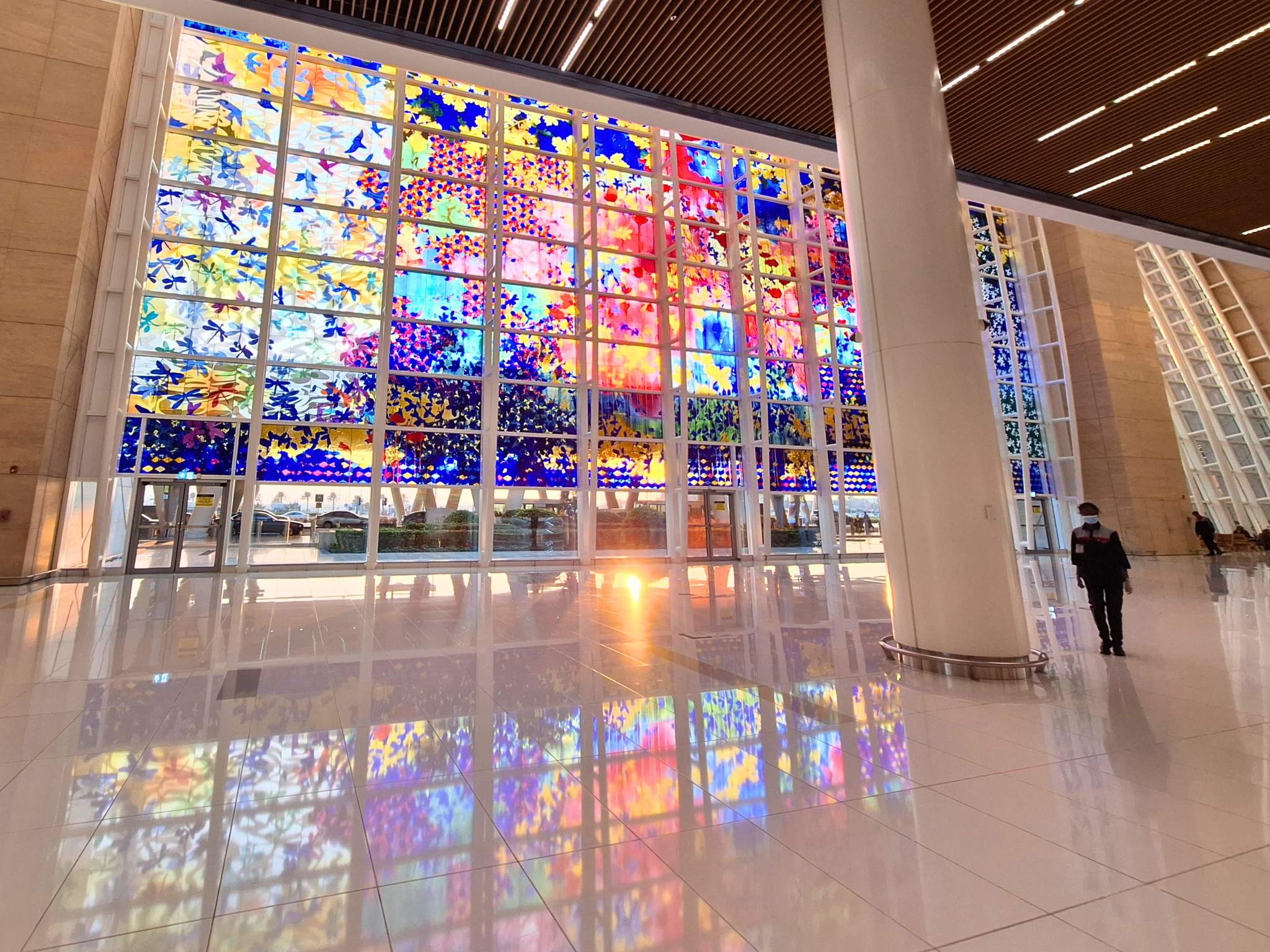 Bahrain international airport arrivals colorful windows Muharraq Manama taxi stand sunset winter travel
