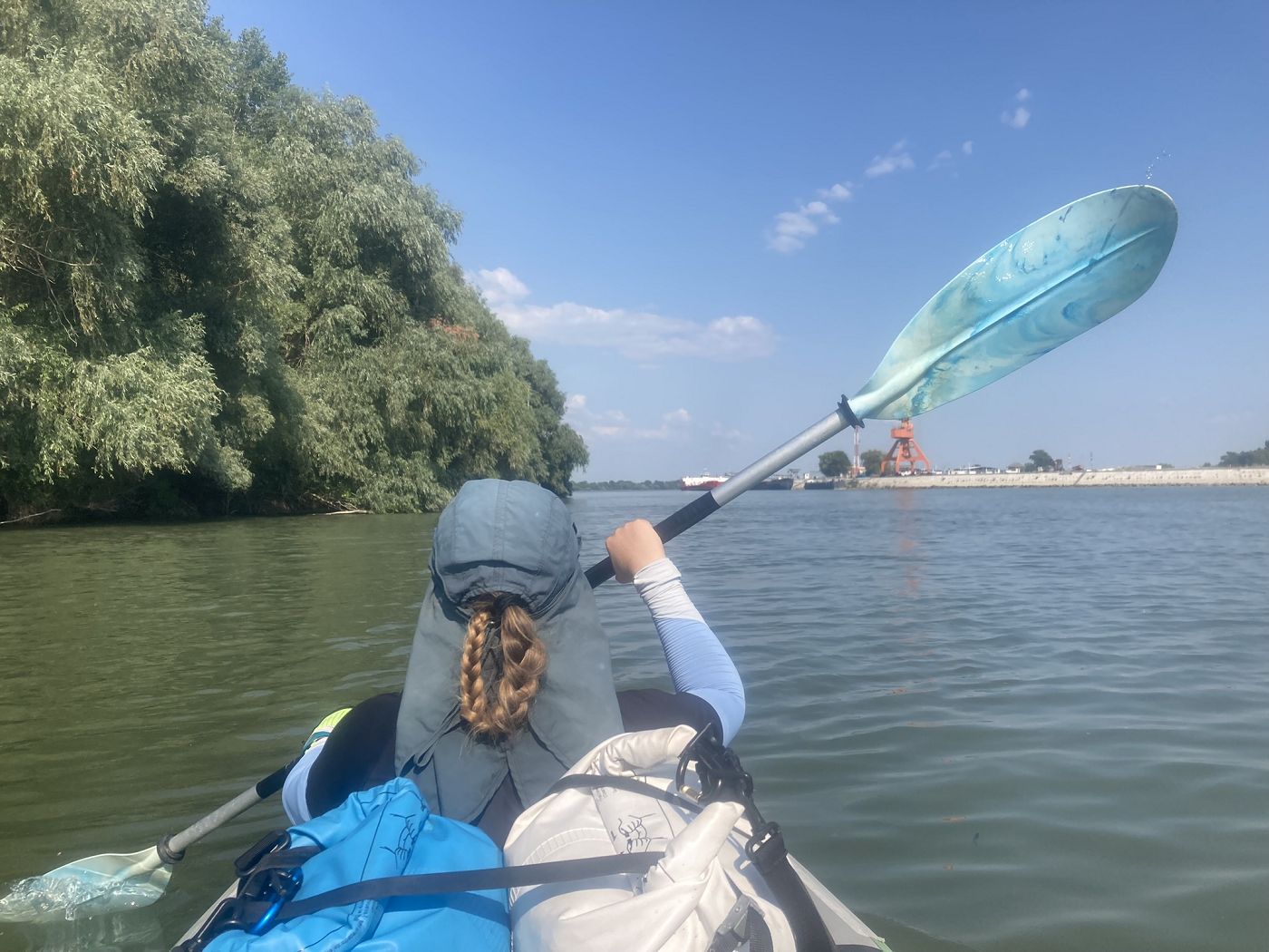 Iris Veldwijk kayaking next to Insula Isaccea island ferry port Romania crossing to Ukraine Danube River