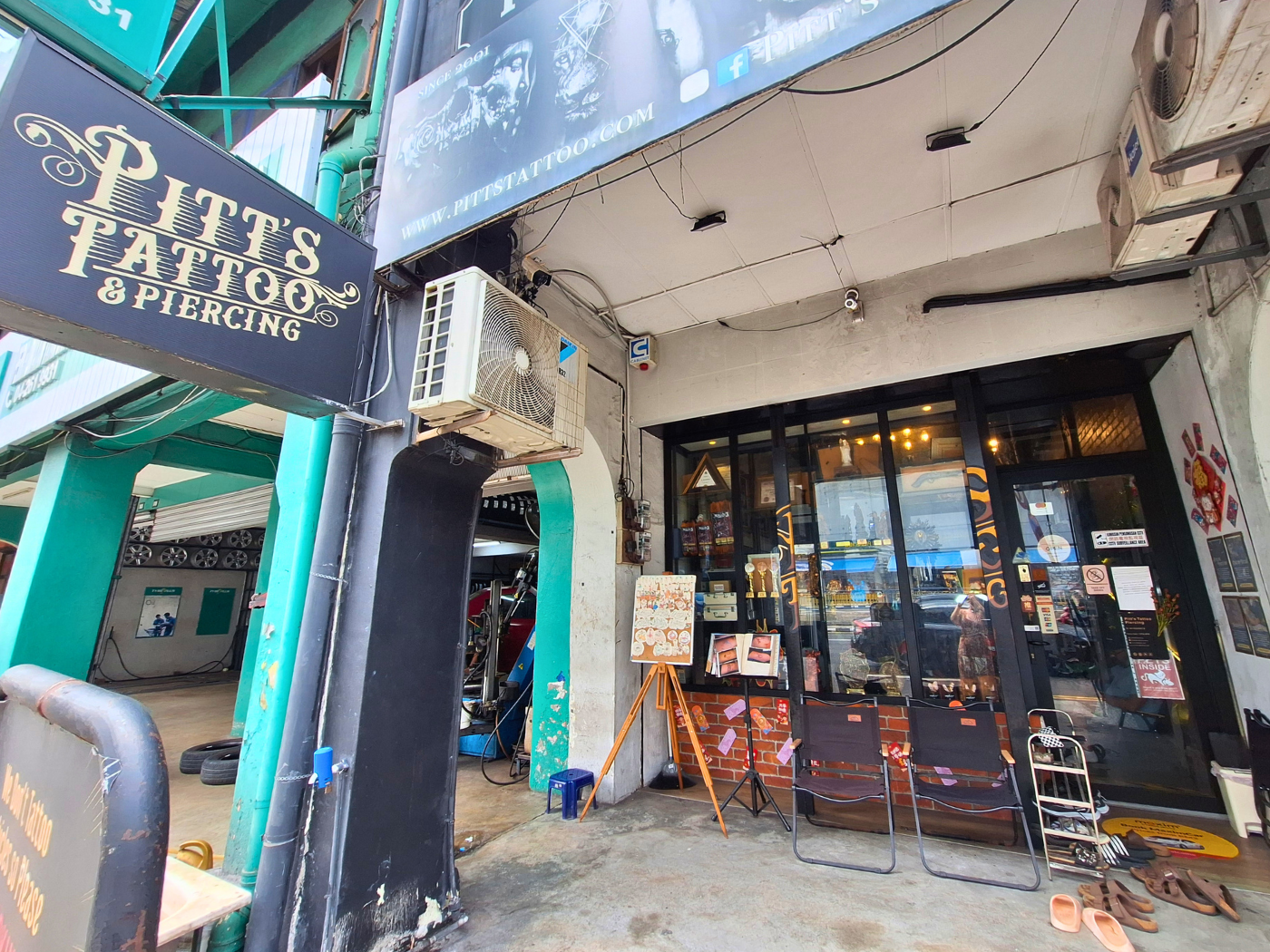 Pitt's tattoo and piercing studio Penang Malaysia George Town cats felines inked southeast Asia cat
